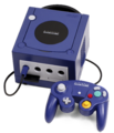 A Nintendo GameCube console with one controller.