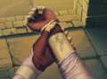 The mark of a blood pact on Micaiah's arm.